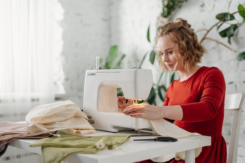 A woman making clothes with a sewing machine